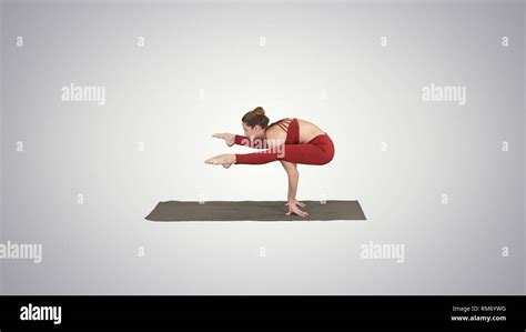 Beautiful Woman Practices Handstand Yoga Asana Tittibhasana Firefly