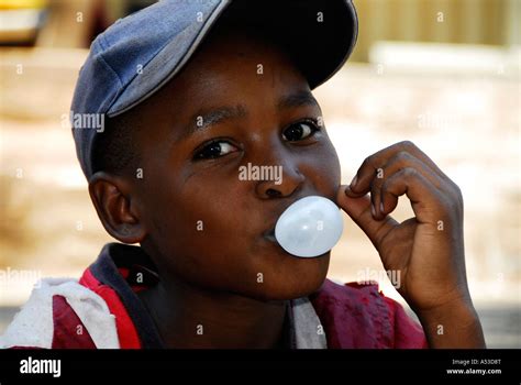 Young African Boy Blowing Bubbles With Chewing Gum Mpulanga South
