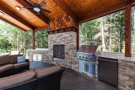 Covered Outdoor Living Area With Grill Refrigerator And Fireplace