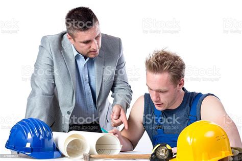 Reviewing Blueprints Stock Photo Download Image Now Adult Adults