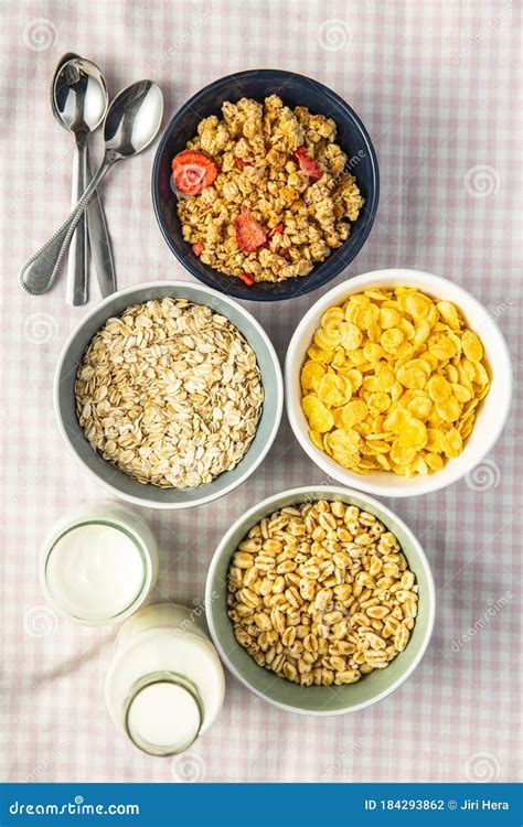 Various Breakfast Cereals In Bowls Puffed Wheat And Oatmeals Stock