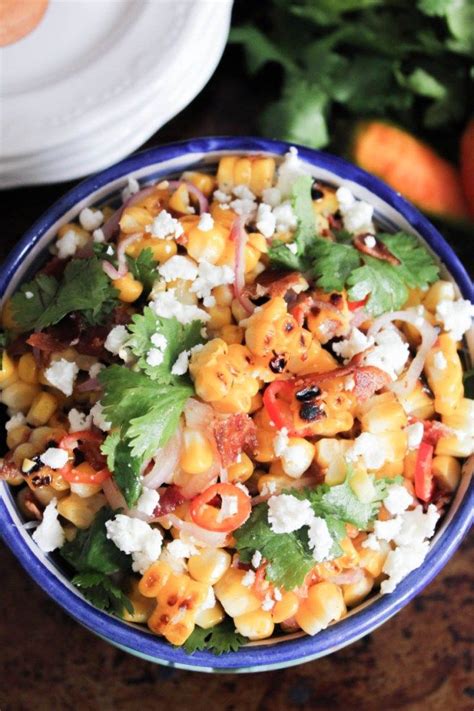 This grilled corn recipe is coated with a cooling lime crema, spiced with some chile powder, and topped with crumbled add your choice of toppings. Charred Corn with Bacon, Chiles and Cheese (aka Mexican Street Corn Salad) | Recipe | Gluten ...