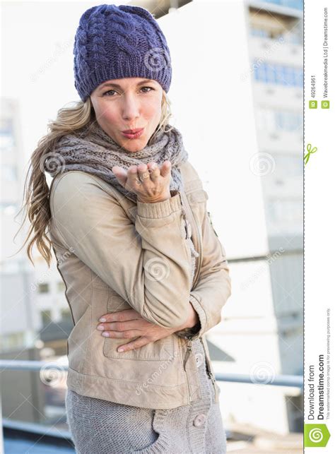 Pretty Blonde In Warm Clothes Blowing A Kiss Stock Image Image Of