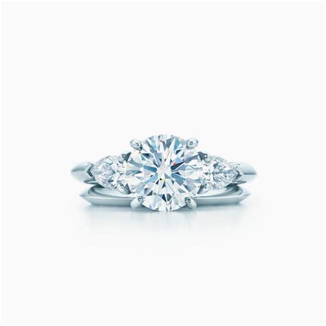 Touch device users, explore by touch or with swipe. Tiffany Three Stone engagement ring with pear-shaped side stones in platinum. | Tiffany & Co.