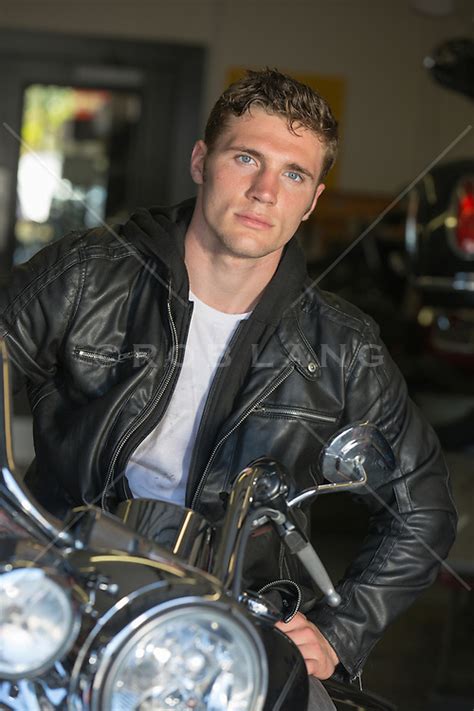Hot Man Sitting On A Harley Davidson Motorcycle Rob Lang Images