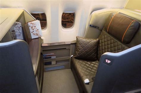 Singapore airlines did a really sleek job with the finishes as well — i love the pattern on the bulkhead, the dark leather. Singapore Airlines 777-300ER First Class Overview - Point ...