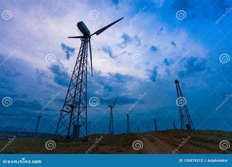 Wind Turbines On Dark Sky Background Alternative Energy Source Stock