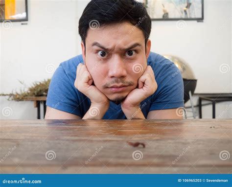 Boring And Serious Face Man Rest His Chin On His Hand Stock Image
