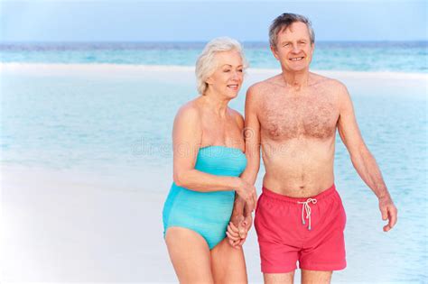 Senior Romantic Couple Walking On Beautiful Tropical Beach Stock Image Image Of Holiday