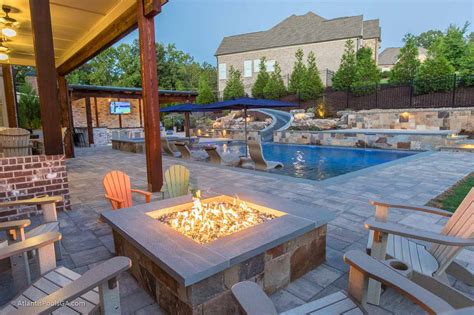An inground gunite pool is made from a steel enforced frame, covered with cement and plaster to create a strong, and durable structure. Linear/Modern Pools - ATLANTIS POOLS & SPAS, LLC