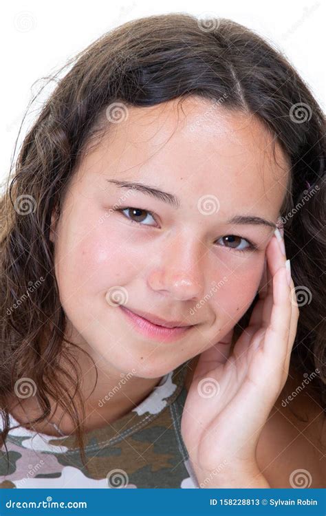 Portrait Of A Smiling Brunette Young Woman Hand On The Cheek Stock