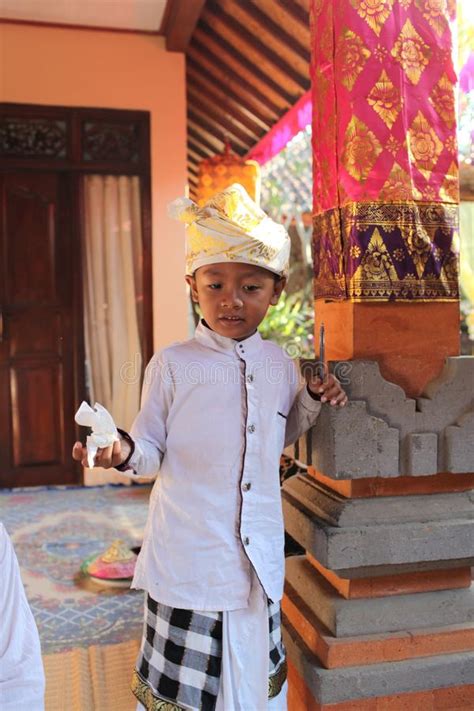 A Very Small Balinese Boy Decorated Due To The Potong Gigi Ceremony