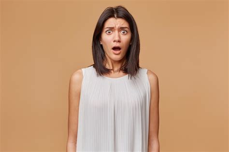 Free Photo Portrait Of Scared Woman In Panic Nervous Frightened Dressed In White Dress Opened