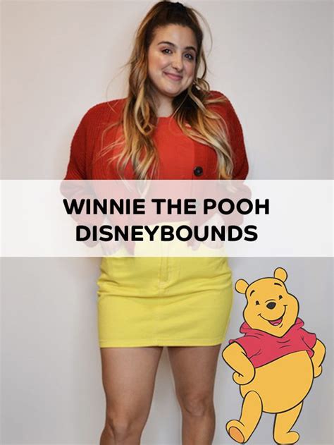 A Woman Standing In Front Of A White Wall With Winnie The Pooh On It
