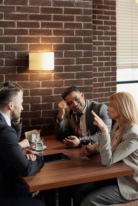Coworkers Talking At A Cafe · Free Stock Photo