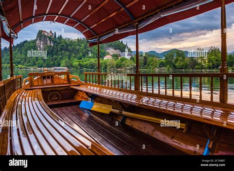 Pletna Rowing Boat And Lake Bled Castle Slovenia In Bled Julian Alps