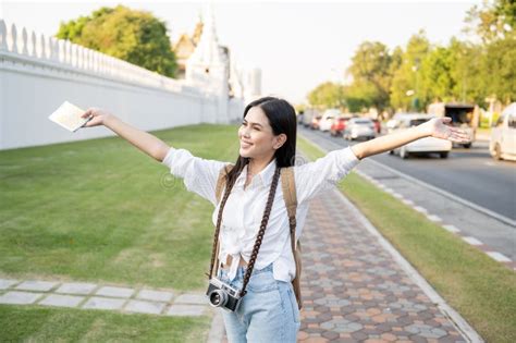 Beautiful Tourist Woman On Vacation Sightseeing And Exploring Bangkok