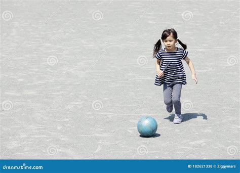 Japanese Girl Dribbling Soccer Ball Stock Photo Image Of Field Blue