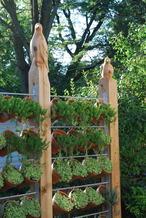 Because a vertical garden takes up relatively little usable space, it is perfect for apartment or condo living. fence posts | Vertical vegetable gardens, Outdoor herb ...
