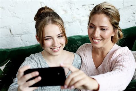 Mature Mother And Her Daughter Making A Selfie Using Smart Phone Stock Image Image Of