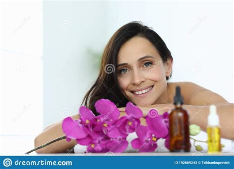 Woman Lies And Smiles In Massage Room Closeup Stock Image Image Of
