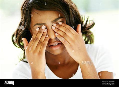Ethnic Girl Rubbing Her Eyes Stock Photo Alamy
