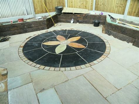 Indian Stone Paving With Black Limestone Circle Featuring An Indian