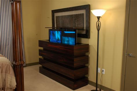 Here Is A Tv Lift Cabinet Showing Tv Half Way Up Against A Wall In