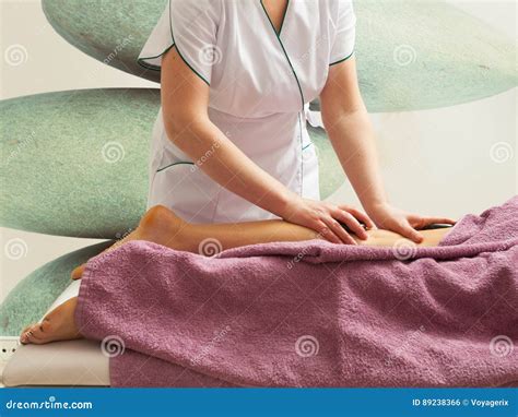 Masseuse Doing Legs Massage With Hot Stones Stock Photo Image Of Wellness Skin