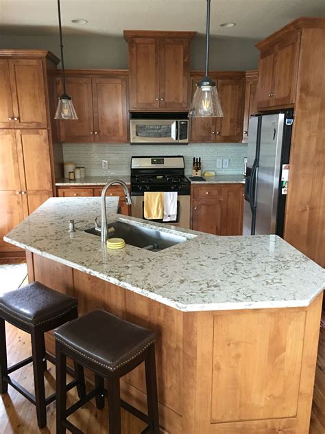 Designers often recommend choosing dark granite with stainless steel appliances and maple cabinets, avoiding tan or gold granite because it clashes with maple's brown tones. My updated kitchen! Cambria Windermere countertops, glass ...
