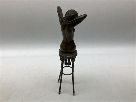 Art Deco Style Bronze Modelled As A Nude Female Figure Seated Upon A