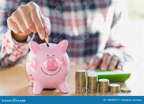 Saving Money Concept Human Hand Putting Money Coin To Piggy Bank Stock A2f