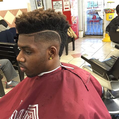 I enjoy recommending this haircut for black men with natural hair who aren't afraid of spending time changing their look from day to day. 40 Amazing Fade Haircuts for Black Men - AtoZ Hairstyles