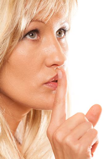 Woman Asking For Silence Finger On Lips Hush Gesture Stock Photo