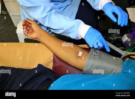 Blood donor at donation, transfusion. Close up right arm of a business