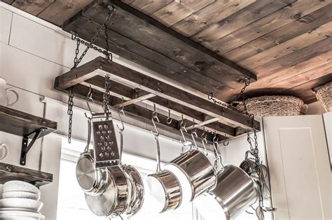 I always hang my plants from the ceiling using a swag hook and an adjustable hanging chain. How to Build a DIY Pot Rack and Secure it to Your Ceiling