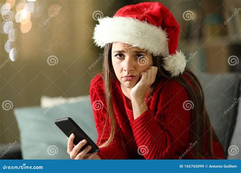 sad woman holding phone at home on christmas holidays stock image image of longing house