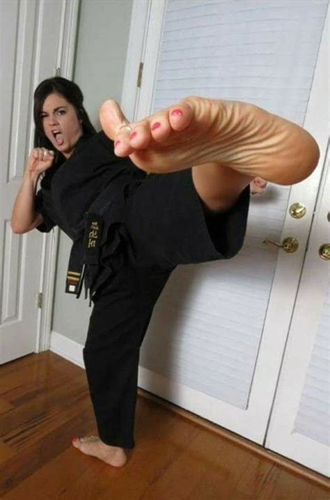 Female Karate Master Strikes A Pose