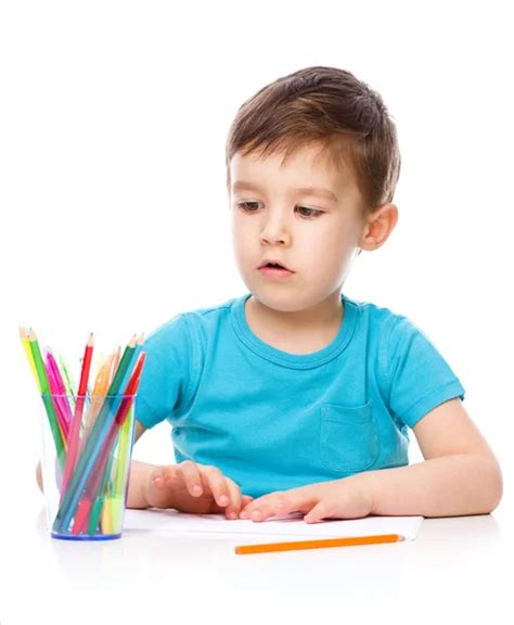 Cute Boy Is Drawing Using Color Pencils Stock Photo By ©julaszka 60478873