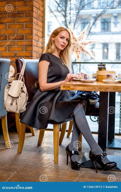 Beautiful Young Woman Sitting At The Table At Cafe Stock Image Image