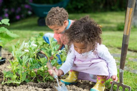 Download Free Planting Kids With Gardening Tools Wallpaper