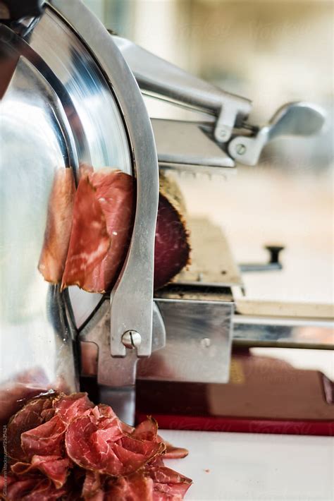 Slicing Meat By Stocksy Contributor Gillian Vann Stocksy