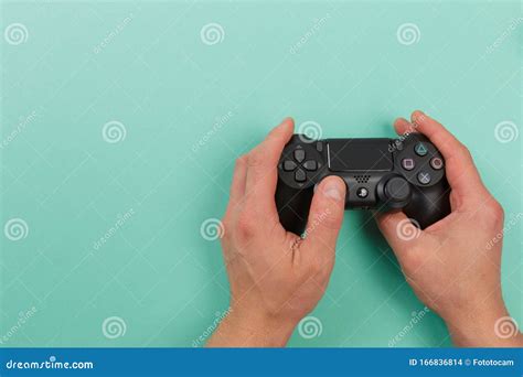 Russia Oktober 24 2019 Male Hands Holding A Ps4 Controller Sony