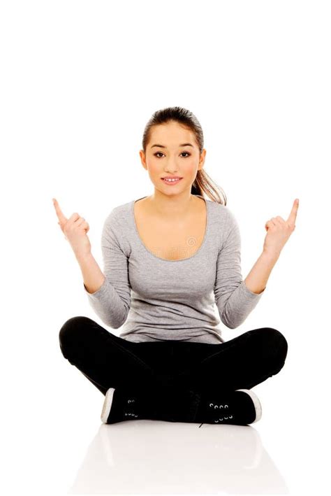 Woman Sitting Cross Legged Pointing Up Stock Image Image Of People