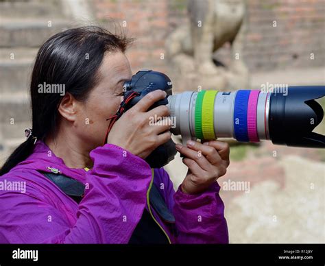 Female Photographer With Canon Dslr Camera Hi Res Stock Photography And