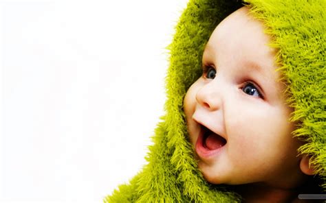 Cute Small Baby With Smile In Green Wallpapers Hd Wallpapers