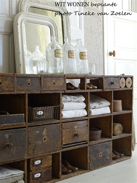 Dark brown wooden floor enhances bold texture compared to gray and white furniture. Farmhouse country rustic and shabby chic style for a ...