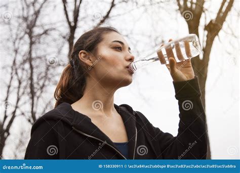 Young Beautiful Woman Drink Water In Outdoors Stock Image Image Of