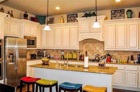 Luckily, it is a great place to store or display items. How to Decorate the Top of Kitchen Cabinets | Home Design ...