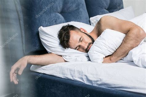 Handsome Young Man Sleeping In Bed — Stock Photo © Allaserebrina 160977700